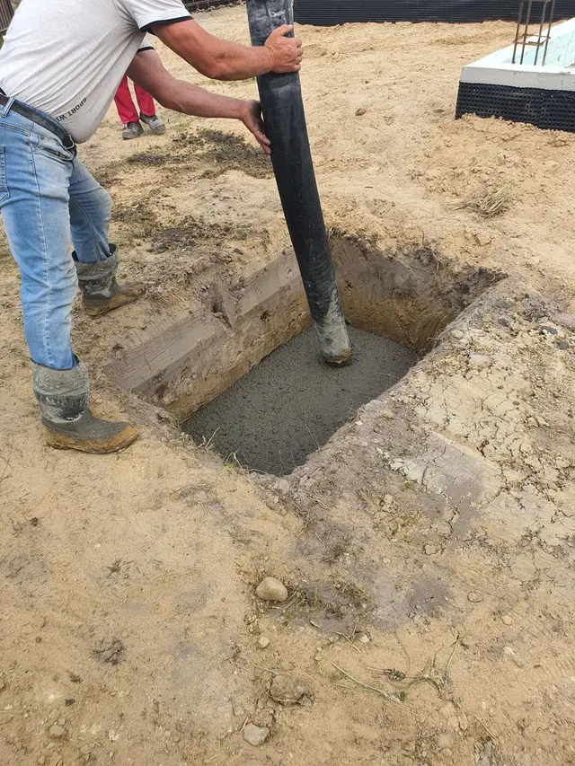 Fresh concrete being poured into a form